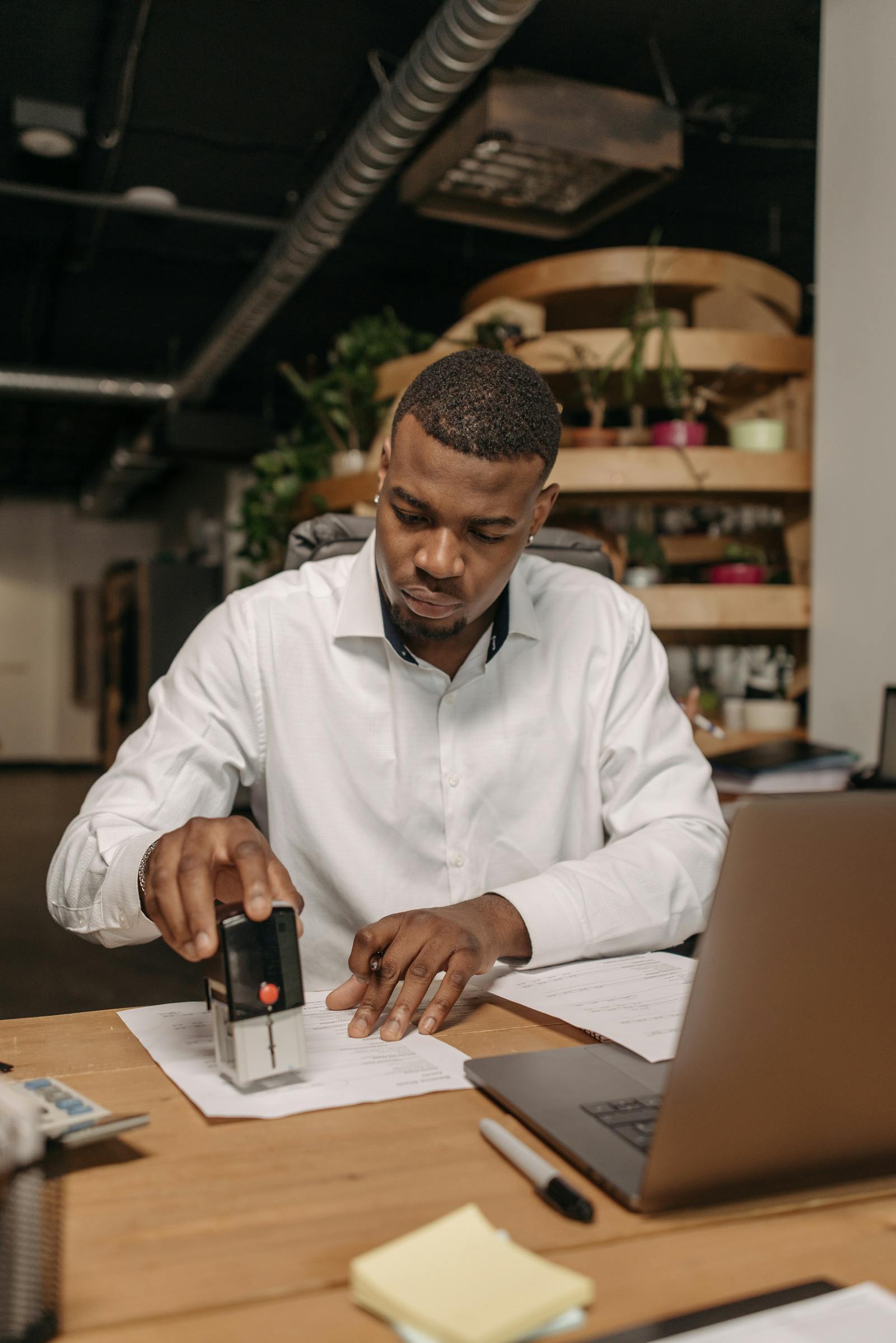 Professional reviewing trademark application documents at a desk